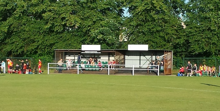 The main stand with the dugouts either side of it.